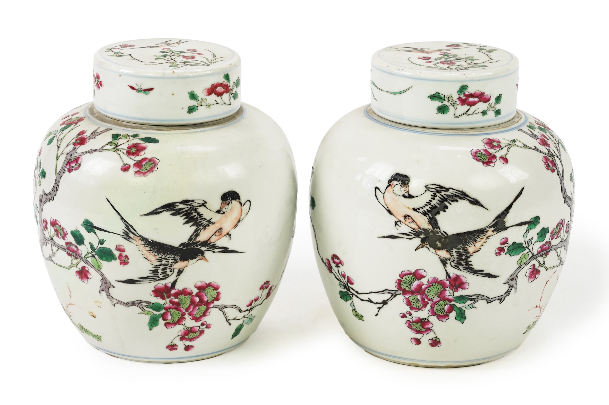 A pair of Chinese famille rose jars and covers, Kangxi mark but late 19th/early 20th century
